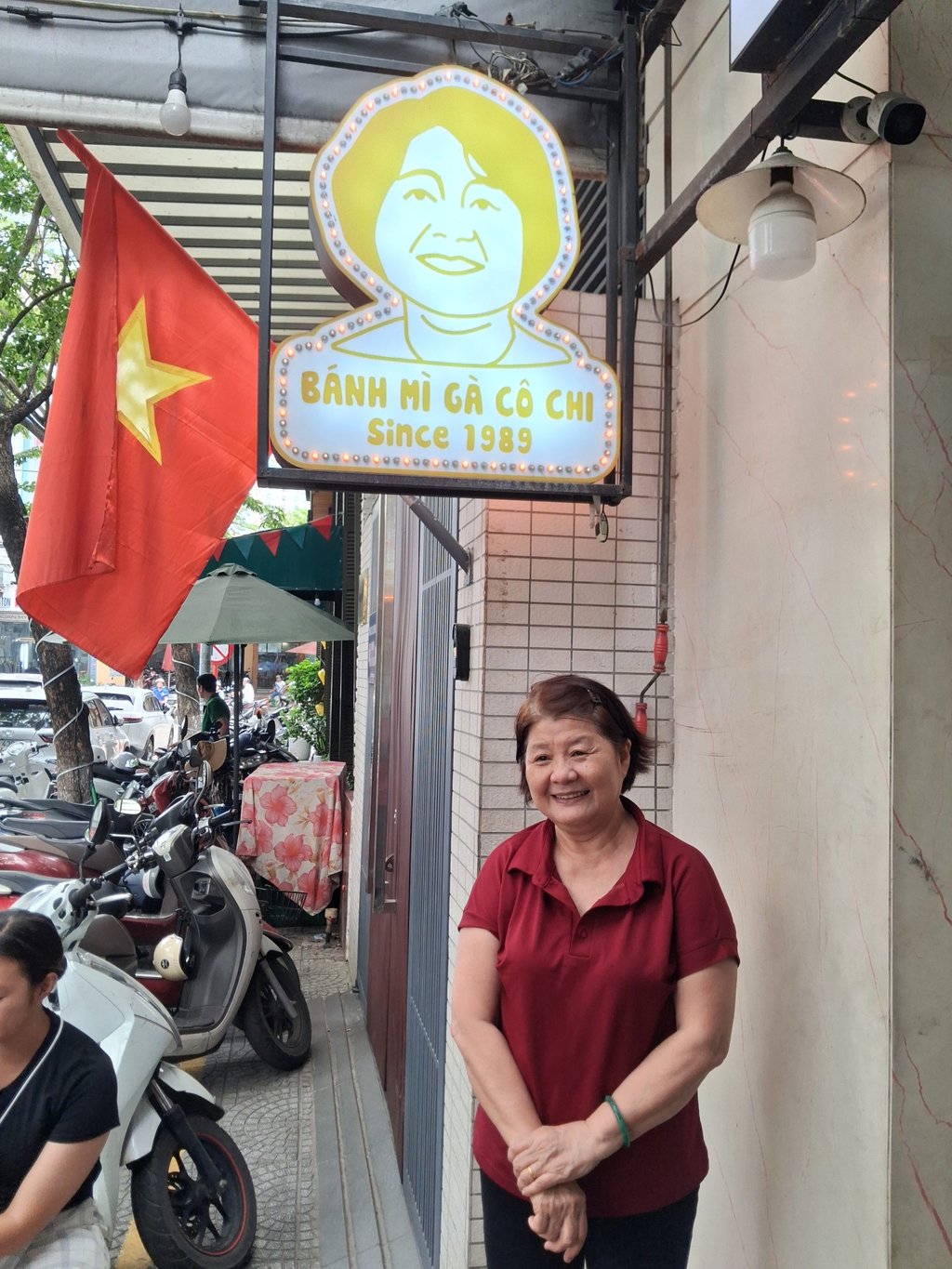 Madame Chi of Banh Mi Ga Co Chi poses outside her restaurant in Da Nang. Photo: Andrew Sun Madame Chi of Banh Mi Ga Co Chi poses outside her restaurant in Da Nang. Photo: Andrew Sun
