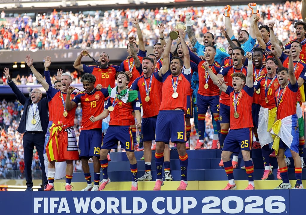 Spain’s Rodri lifts the trophy as the team celebrate winning the World Cup final against Argentina. Photo: EPA