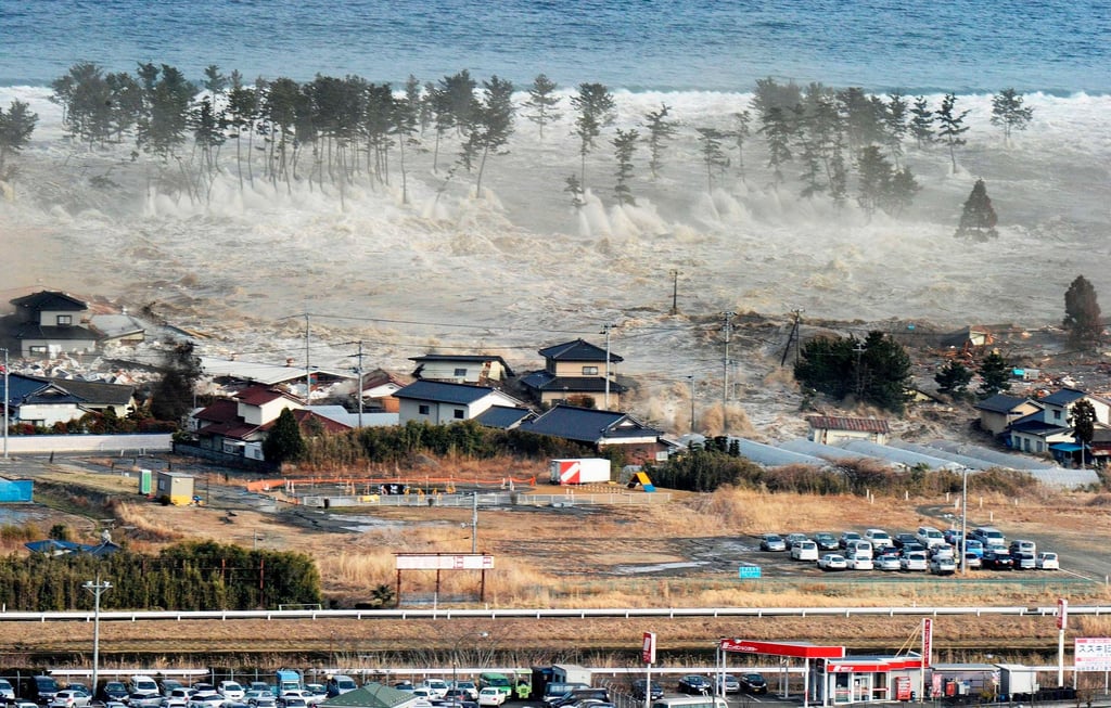Waves of a tsunami hit residences after a powerful earthquake in Natori, Miyagi prefecture, Japan, on March 11, 2011. Photo: Kyodo/AP Waves of a tsunami hit residences after a powerful earthquake in Natori, Miyagi prefecture, Japan, on March 11, 2011. Photo: Kyodo/AP