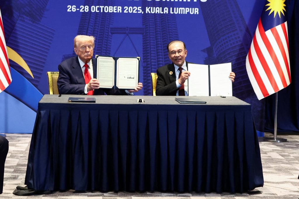 US President Donald Trump and Malaysian Prime Minister Anwar Ibrahim hold up trade deal documents during a meeting in Kuala Lumpur in October. Photo: Reuters US President Donald Trump and Malaysian Prime Minister Anwar Ibrahim hold up trade deal documents during a meeting in Kuala Lumpur in October. Photo: Reuters