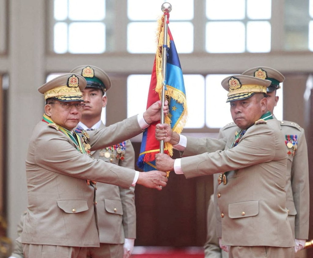Myanmar leader Min Aung Hlaing (left) hands over a flag to newly appointed commander-in-chief Ye Win Oo during a ceremony in March. Photo: Myanmar Military True News Information Team via Reuters Myanmar leader Min Aung Hlaing (left) hands over a flag to newly appointed commander-in-chief Ye Win Oo during a ceremony in March. Photo: Myanmar Military True News Information Team via Reuters