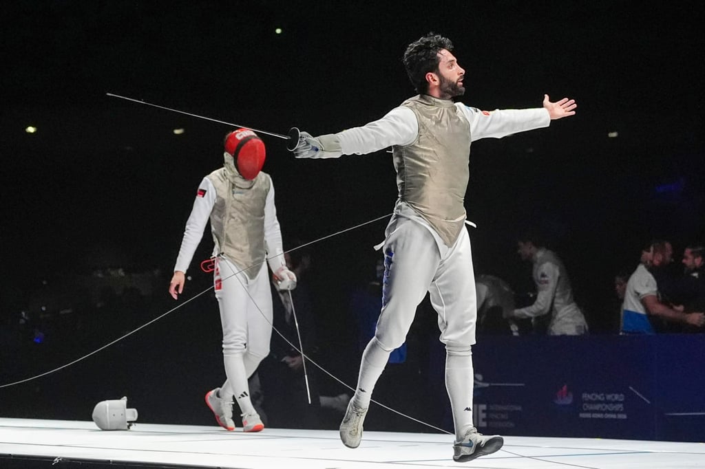 Guillaume Bianchi (right) celebrates beating Ryan Choi and sealing gold for Italy. Photo: Elson Li