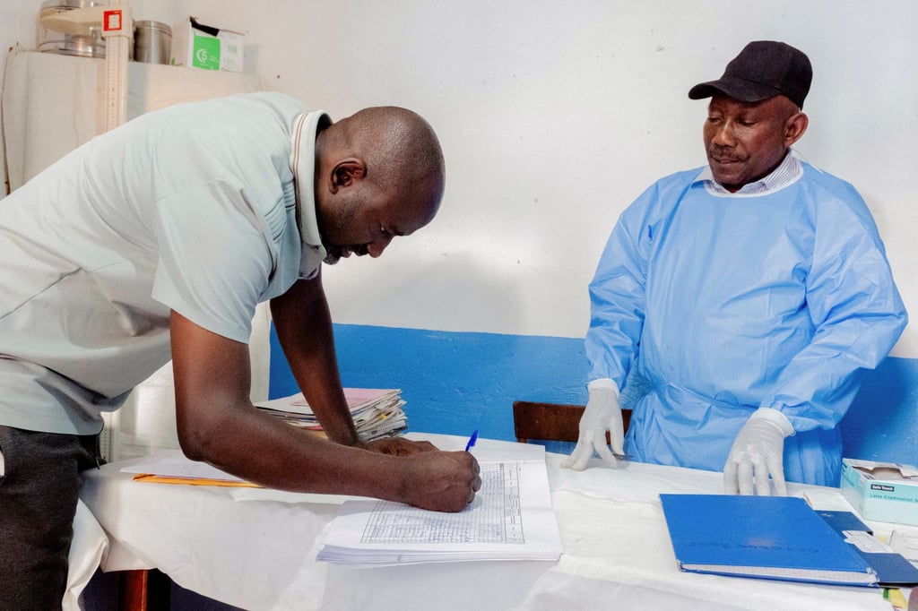 Dr. Moubarack Kano, 40, looks at medical records at a health facility in Bunia, Ituri province, Democratic Republic of Congo, on July 10 as aid agencies intensify efforts to contain the Ebola outbreak. Photo: Reuters