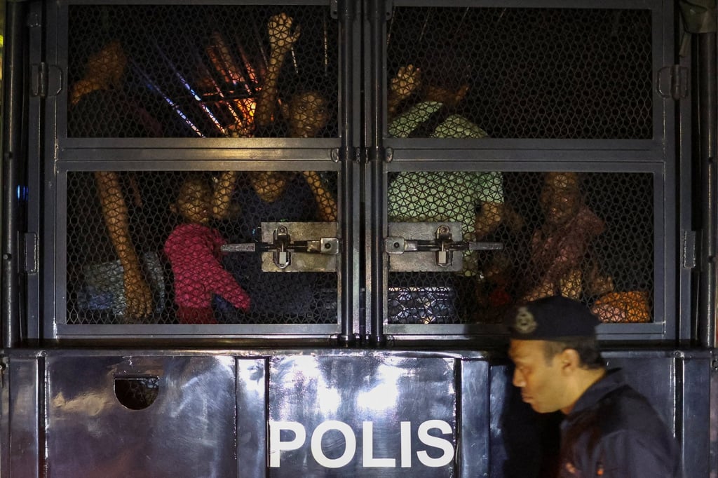 Rohingya refugees inside a truck as they are taken by police, in front of the office of the UN Refugee Agency, after being evicted from their homes, in Kuala Lumpur, Malaysia, on Monday. Photo: Reuters Rohingya refugees inside a truck as they are taken by police, in front of the office of the UN Refugee Agency, after being evicted from their homes, in Kuala Lumpur, Malaysia, on Monday. Photo: Reuters