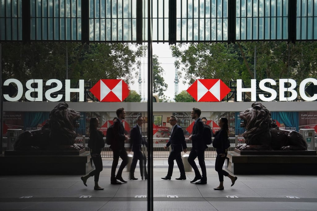 Pedestrians walk past HSBC’s head office in Central. Photo: Elson Li