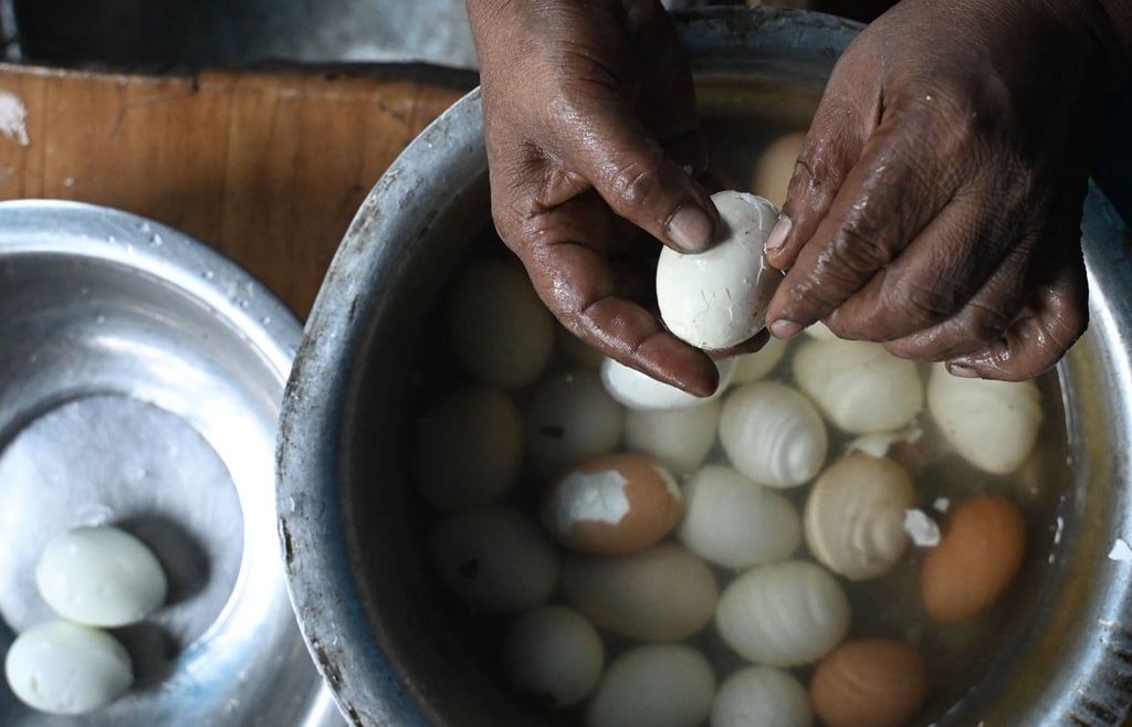 A shopkeeper prepares boiled eggs at his roadside stall in Kolkata on July 10. Eggs, which Hindus consider non-vegetarian, are widely consumed in India. Photo: AFP A shopkeeper prepares boiled eggs at his roadside stall in Kolkata on July 10. Eggs, which Hindus consider non-vegetarian, are widely consumed in India. Photo: AFP