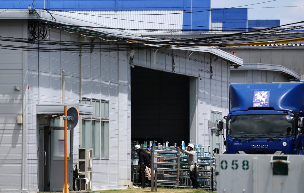 Employees at the Aisin Kyushu plant return to work on Friday after Tuesday’s earthquake. Photo: Reuters Employees at the Aisin Kyushu plant return to work on Friday after Tuesday’s earthquake. Photo: Reuters