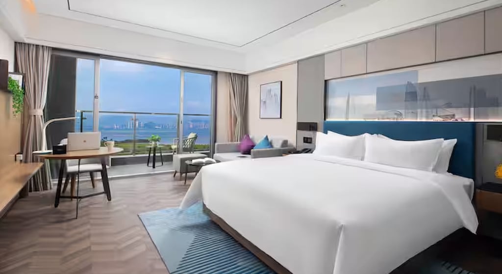 Guests at Hampton Apartments by Hilton Shenzhen Futian Mangrove Park can enjoy sea views over Shenzhen Bay. Photo: Handout Guests at Hampton Apartments by Hilton Shenzhen Futian Mangrove Park can enjoy sea views over Shenzhen Bay. Photo: Handout