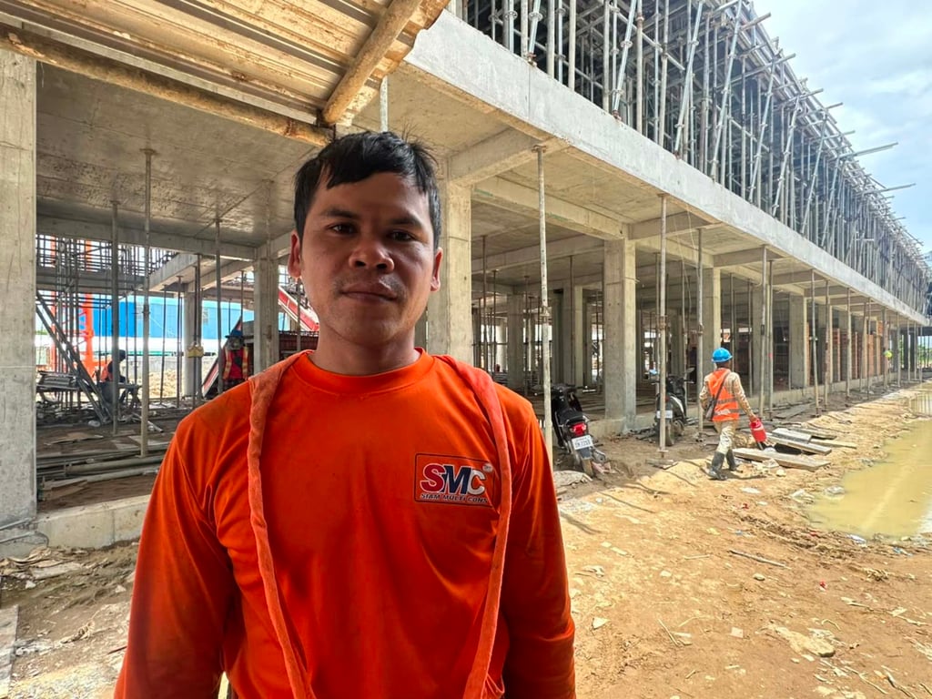 Vin Lors, a 37-year-old Cambodian, working at a construction site in Phnom Penh in August. He used to work in construction in Thailand. Photo: Sinorn Thang
