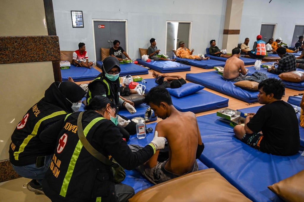 A survivor of a ferry fire is given medical attention at Indonesia’s Tanjung Perak port in Surabaya on Monday. Photo: AFP A survivor of a ferry fire is given medical attention at Indonesia’s Tanjung Perak port in Surabaya on Monday. Photo: AFP