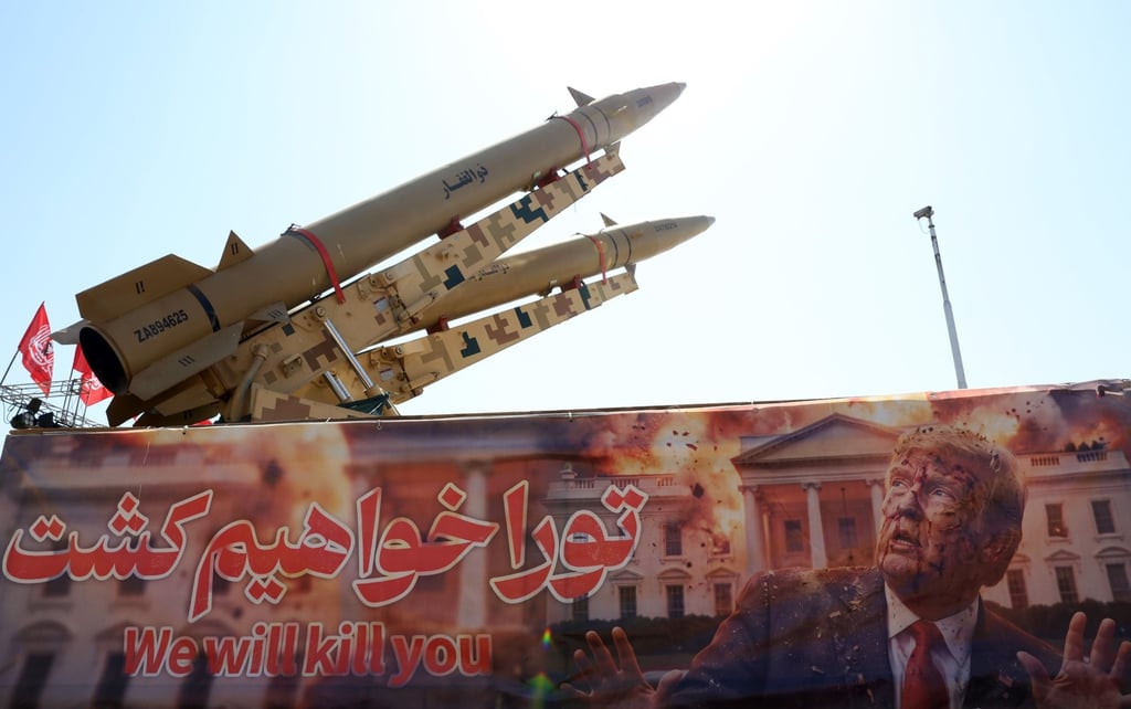 Iranian missiles on display in Tehran above a banner depicting US President Donald Trump. Photo: EPA Iranian missiles on display in Tehran above a banner depicting US President Donald Trump. Photo: EPA