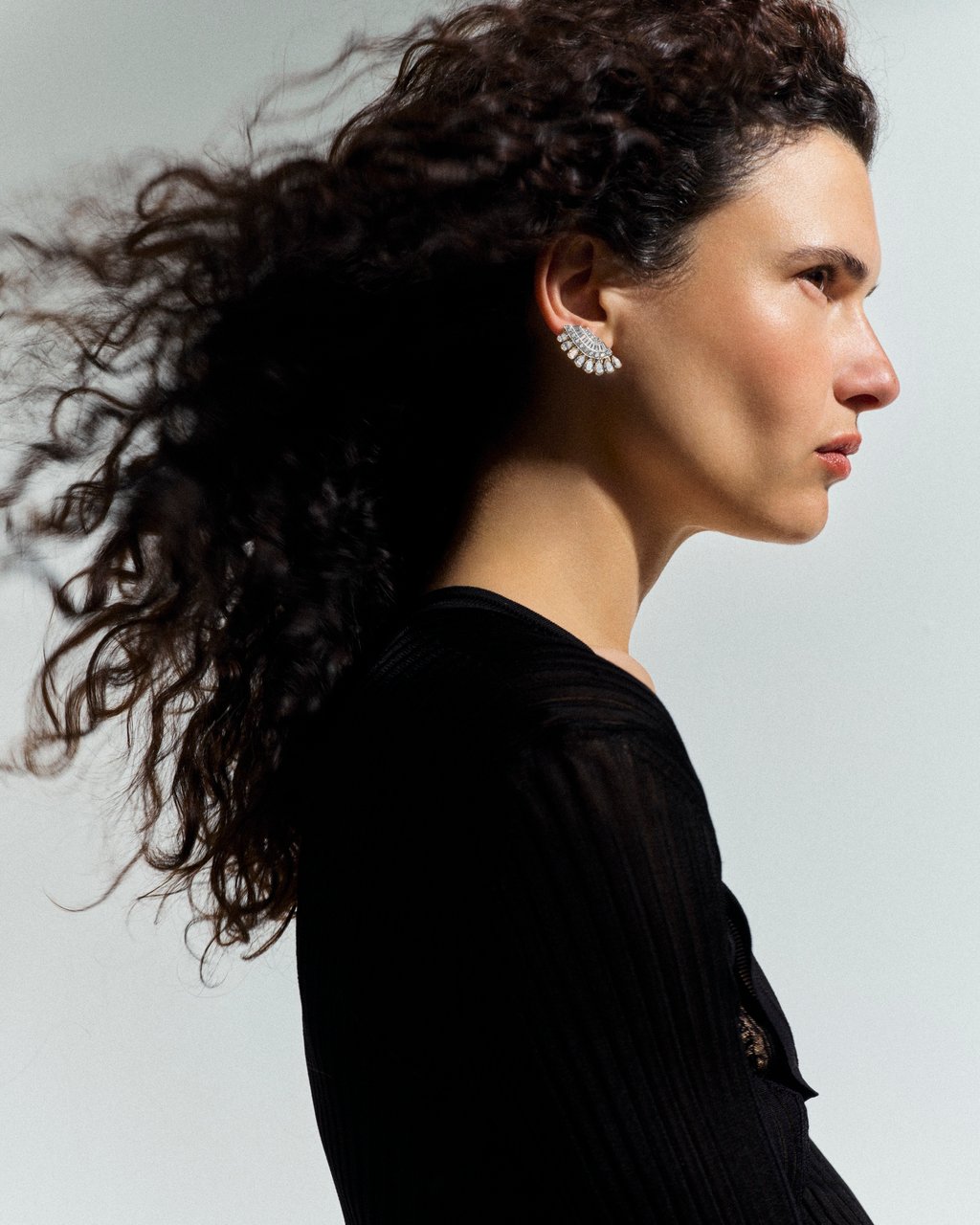 Earring: Van Cleef & Arpels. Sweater: Balmain Earring: Van Cleef & Arpels. Sweater: Balmain
