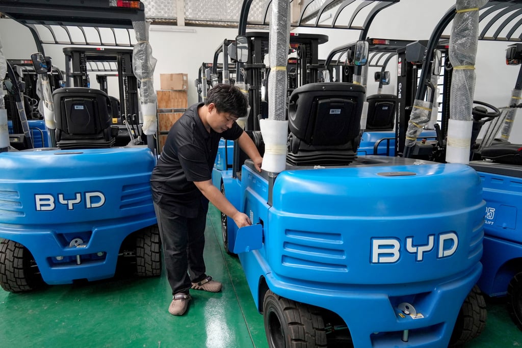 The manager of Huochacha New Energy Group inspects a forklift made by China’s BYD at his factory in Bac Ninh province, Vietnam, in April 2024. Photo: AFP The manager of Huochacha New Energy Group inspects a forklift made by China’s BYD at his factory in Bac Ninh province, Vietnam, in April 2024. Photo: AFP