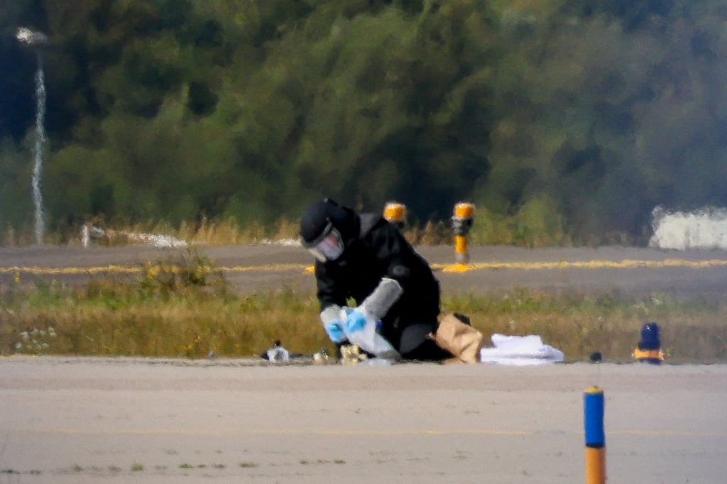 A police officer in protective clothing works at Leipzig-Halle Airport in Schkeuditz, Germany, on Wednesday. Photo: Reuters