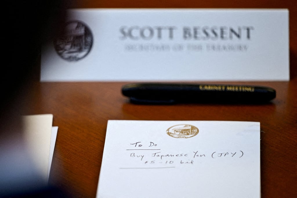 A notepad in front of US Secretary of the Treasury Scott Bessent reads “To Do: Buy Japanese Yen” as he participates in a cabinet meeting at Camp David, Maryland, US, on July 31. Photo: Reuters