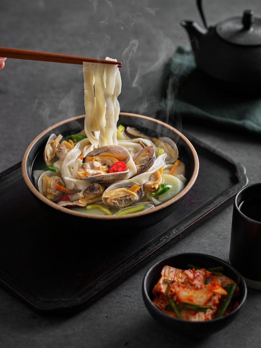 Kalguksu is a noodle soup made with handmade noodles that is often served with kimchi. Photo: Getty Images/ImaZinS RF Kalguksu is a noodle soup made with handmade noodles that is often served with kimchi. Photo: Getty Images/ImaZinS RF