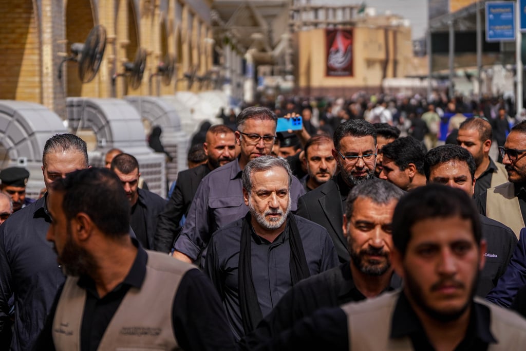 Iran’s Foreign Minister Abbas Araghchi, centre, surrounded by security personnel on Monday in the holy Iraqi city of Najaf ahead of Arbaeen, one of the largest annual Shi’ite religious gatherings. Photo: AP