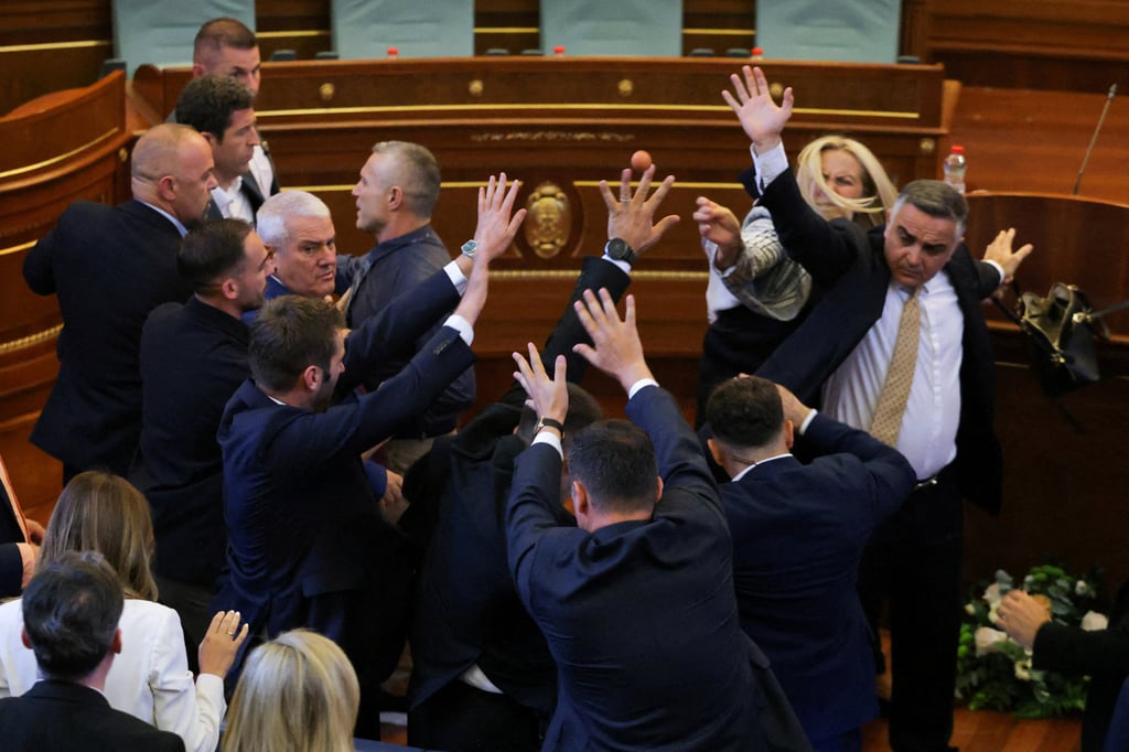 Opposition lawmaker Time Kadrijaj throws an egg at Prime Minister Albin Kurti (not pictured) during a plenary session to elect the new speaker of the parliament, in Pristina, Kosovo, on Saturday. Photo: Reuters