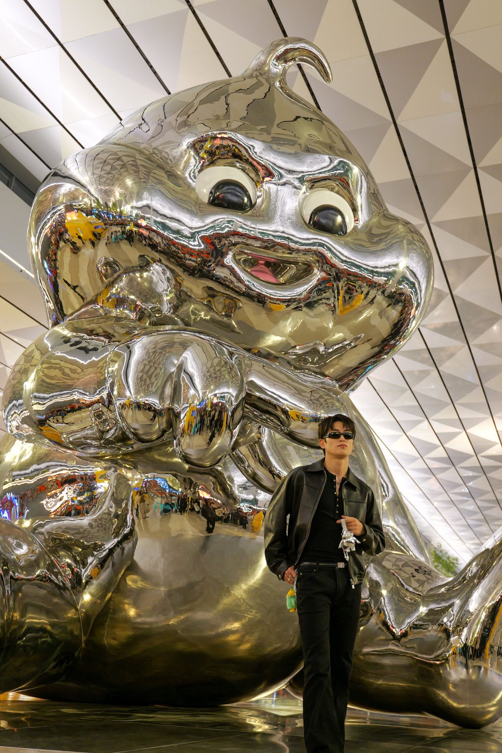 South Korean singer Jaehyun of NCT poses with the 15-metre chrome statue of Butter Baby at the brand’s new store inside Jakarta’s Soekarno-Hatta International Airport. Photo: Handout South Korean singer Jaehyun of NCT poses with the 15-metre chrome statue of Butter Baby at the brand’s new store inside Jakarta’s Soekarno-Hatta International Airport. Photo: Handout