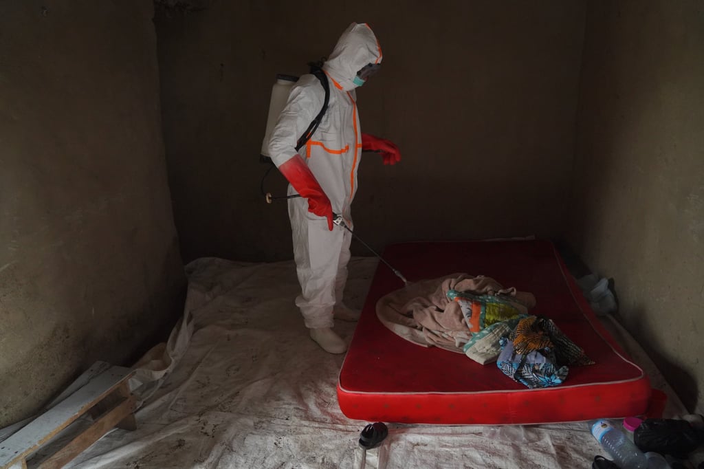 Wiza Bondele, a health worker on the Ebola prevention and control team, at work in Ituri province, eastern Congo, on Wednesday. Photo: AP Wiza Bondele, a health worker on the Ebola prevention and control team, at work in Ituri province, eastern Congo, on Wednesday. Photo: AP