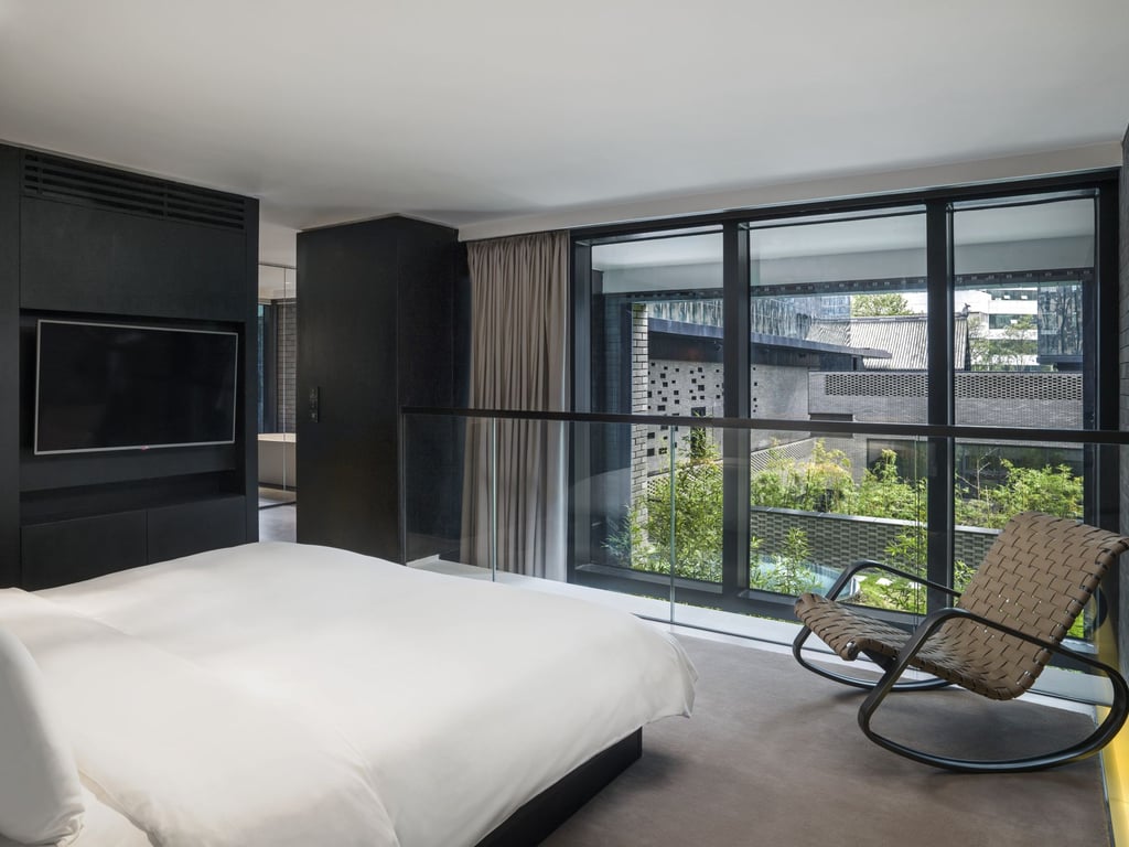 A bedroom in a Loft Suite overlooking one of the courtyards. Photo: Handout A bedroom in a Loft Suite overlooking one of the courtyards. Photo: Handout