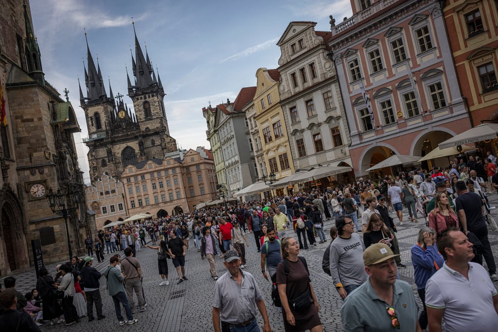 Tourists walk through the Old Town Square in Prague, Czechia. The Czech people are famously reticent with strangers. Photo: LightRocket via Getty Images Tourists walk through the Old Town Square in Prague, Czechia. The Czech people are famously reticent with strangers. Photo: LightRocket via Getty Images