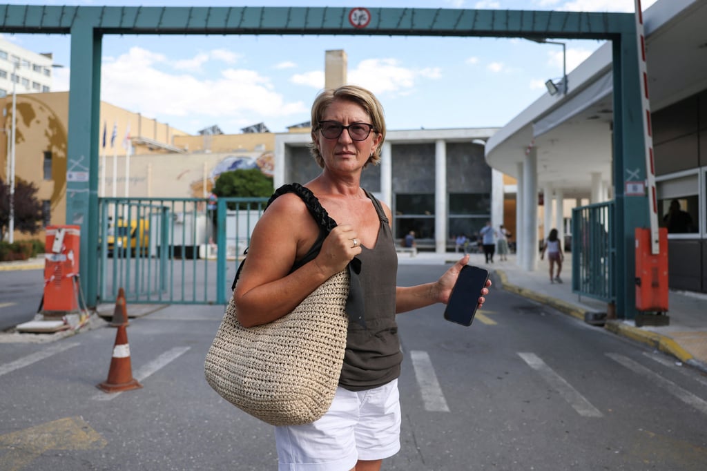Svetlana Grkovic Maksimovic, the wife of the Ryanair passenger partially sucked out of a broken window, stands in front of the hospital where her husband was taken in Thessaloniki, Greece, in July. Photo: Reuters Svetlana Grkovic Maksimovic, the wife of the Ryanair passenger partially sucked out of a broken window, stands in front of the hospital where her husband was taken in Thessaloniki, Greece, in July. Photo: Reuters