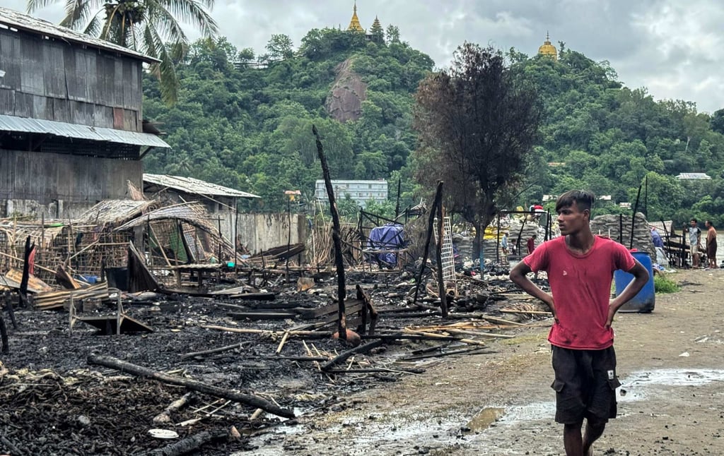 A man walks past the ruins of a building after an air strike by Myanmar’s military in Kyauktaw, western Rakhine State on June 18. Photo: AFP A man walks past the ruins of a building after an air strike by Myanmar’s military in Kyauktaw, western Rakhine State on June 18. Photo: AFP
