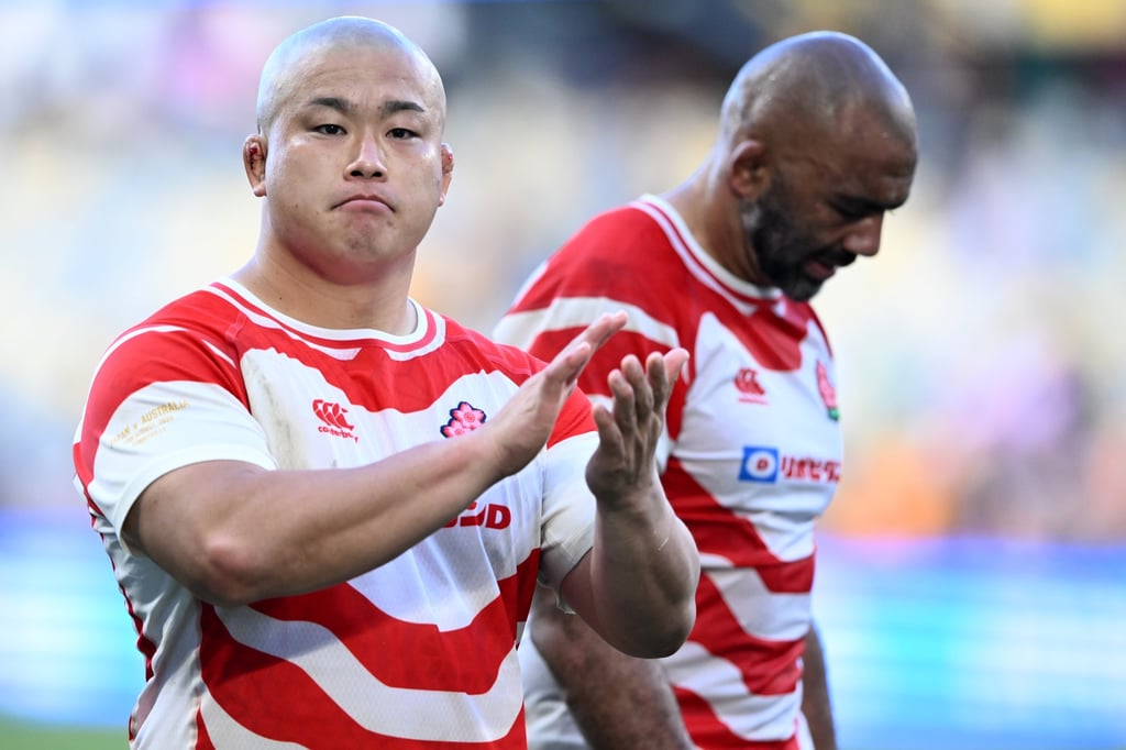 Shuhei Takeuchi of Japan applauds the fans after losing to Australia in a rugby Test match. Photo: EPA Shuhei Takeuchi of Japan applauds the fans after losing to Australia in a rugby Test match. Photo: EPA