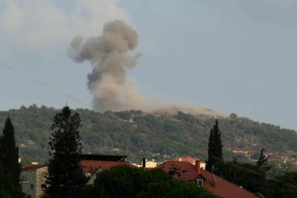Smoke rises from the site of Israeli strikes that targeted the strategic Ali Taher hill early on Saturday. Photo: AFP