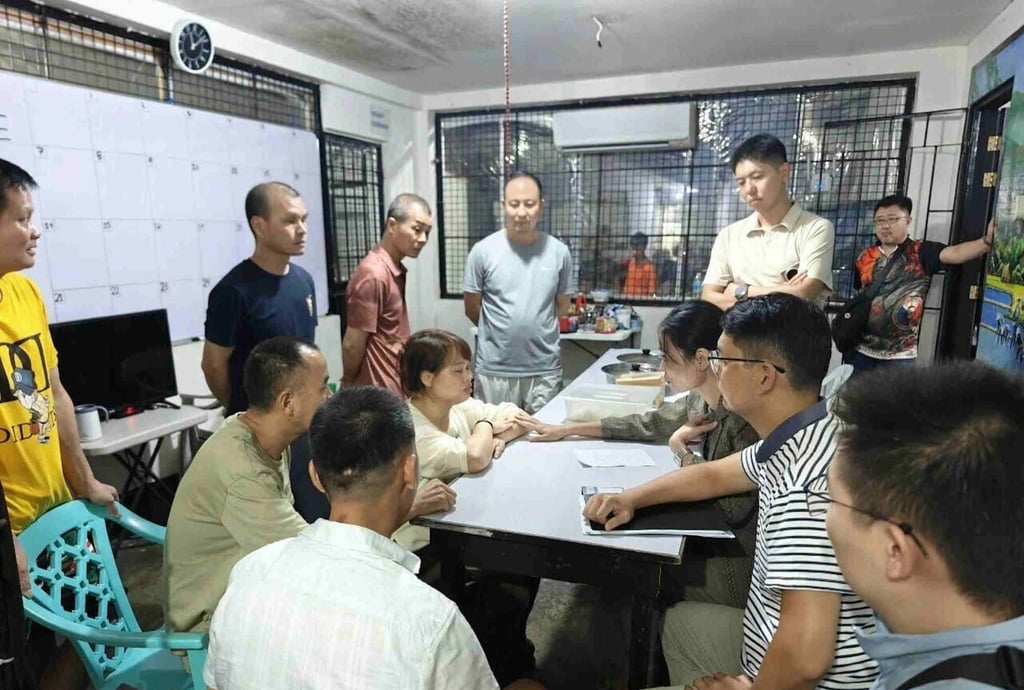 Consular officials assist Chinese nationals after their release from Philippine custody in May. Photo: Embassy of China in the Philippines