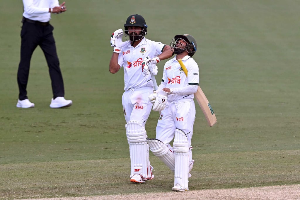 Bangladesh batsmen Shadman Islam (left) and Mominul Haque celebrate after hitting their team’s winning runs. Photo: AFP Bangladesh batsmen Shadman Islam (left) and Mominul Haque celebrate after hitting their team’s winning runs. Photo: AFP