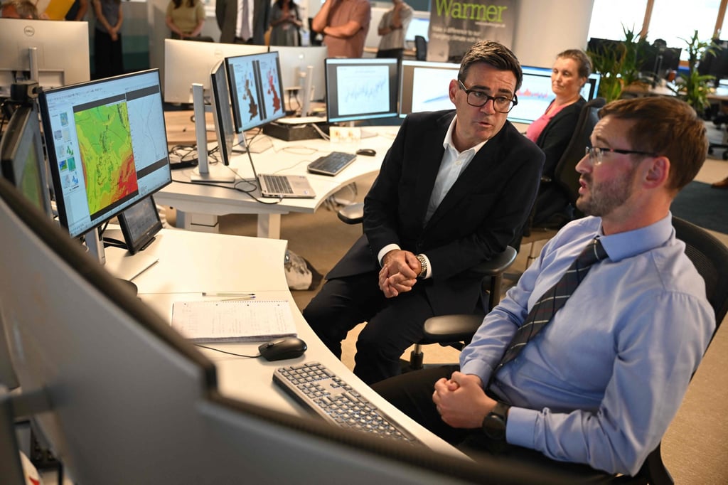 Britain’s Prime Minister Andy Burnham meets the Met Office’s chief forecaster, Dan Harris, in Exeter to discuss the UK’s response to extreme heat, drought and wildfires on Friday. Photo: AFP