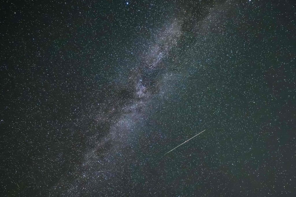 A shooting star and the Milky Way are pictured in Grossmugl, Austria, on August 13. Photo: AFP