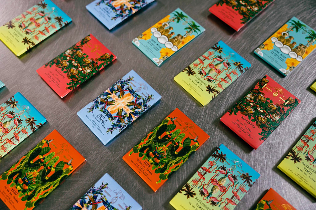 Conspiracy Chocolate’s vivid packaging draws on the cocoa beans’ diverse origins. Photo: Handout Conspiracy Chocolate’s vivid packaging draws on the cocoa beans’ diverse origins. Photo: Handout
