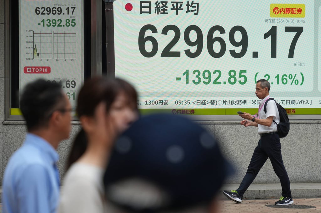 A person walks past an electronic board showing the US dollar and Japanese yen exchange rate at a securities firm in Tokyo on August 3, after the US and Japan launched a coordinated operation to prop up the Japanese currency. Photo: AP A person walks past an electronic board showing the US dollar and Japanese yen exchange rate at a securities firm in Tokyo on August 3, after the US and Japan launched a coordinated operation to prop up the Japanese currency. Photo: AP