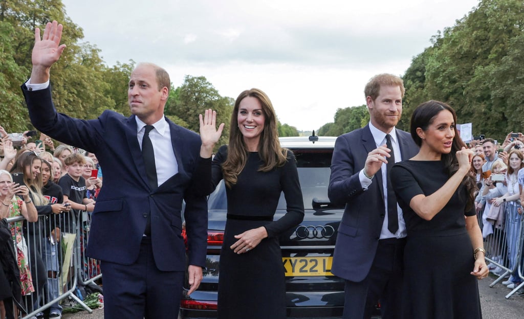 William, Catherine, Harry and Meghan wave to members of the public at Windsor Castle following the passing of Britain’s Queen Elizabeth, in September 2022. Photo: Pool via Reuters