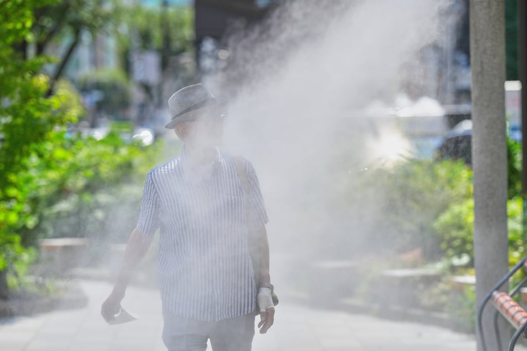 A person walks through mist from a cooling system on a hot day in Tokyo in August. Japan has been hit by one of its most severe heatwaves in recent years. Photo: AP A person walks through mist from a cooling system on a hot day in Tokyo in August. Japan has been hit by one of its most severe heatwaves in recent years. Photo: AP