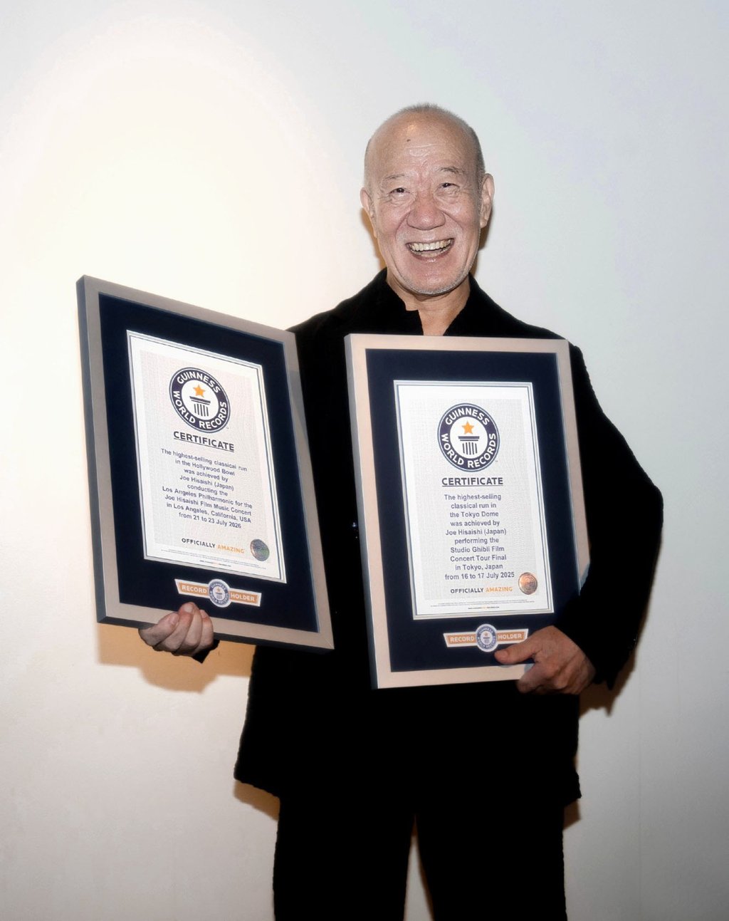Hisaishi, whose Ghibli scores include Nausicaa of the Valley of the Wind, My Neighbor Totoro, Princess Mononoke and Spirited Away, holds certificates from Guinness World Records in New York on August 11, 2026. Photo: Kyodo