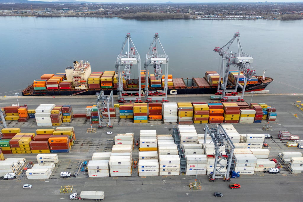 A container ship is loaded while docked at the Port of Montreal in Quebec, Canada. Photo: Reuters