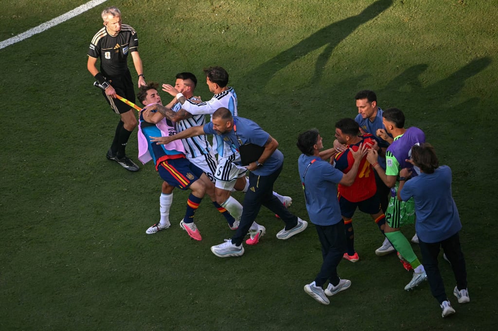 Players from Spain and Argentina are involved in a scuffle after the World Cup final. Photo: TNS Players from Spain and Argentina are involved in a scuffle after the World Cup final. Photo: TNS