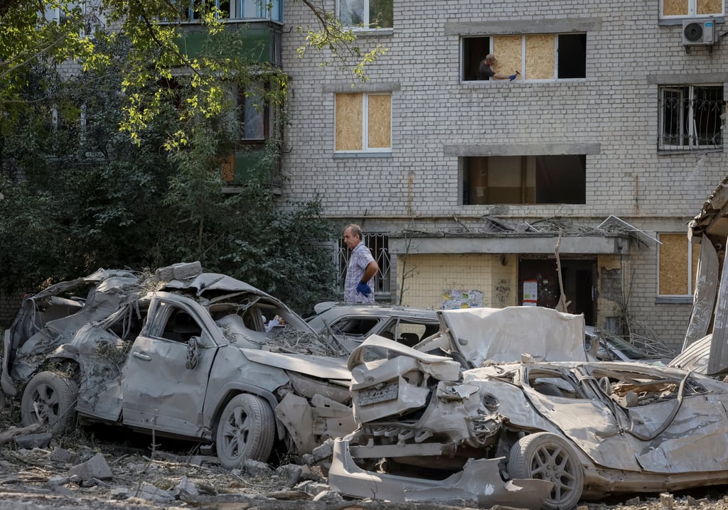 A man at the site of a missile strike in Kyiv on Thursday, amid Russia’s attack on Ukraine. Photo: Reuters