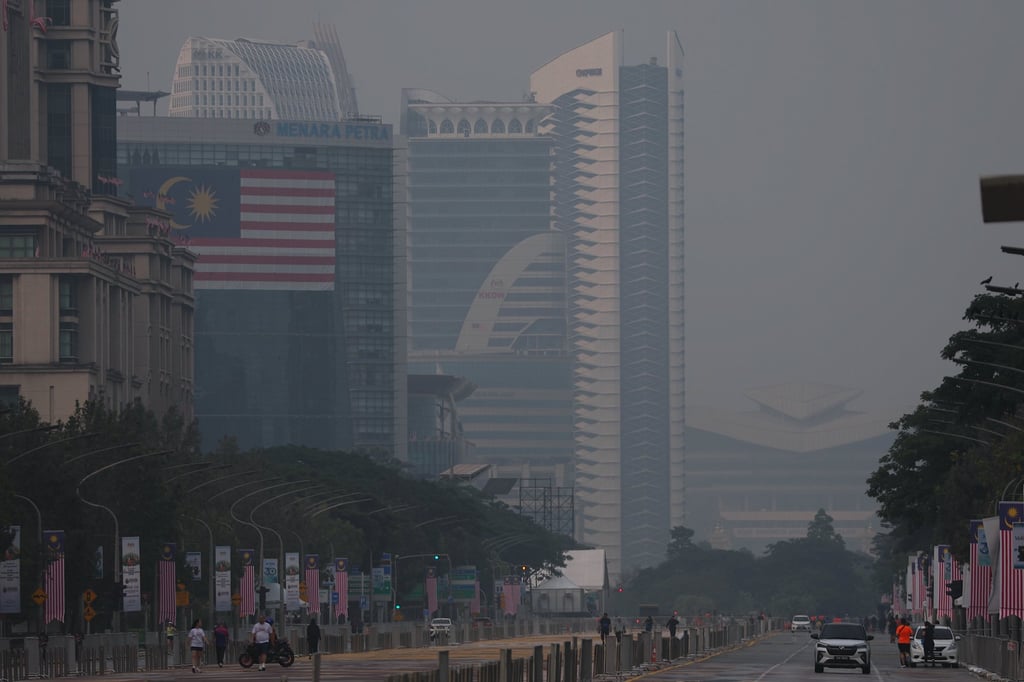Government buildings shrouded in haze in Putrajaya, Malaysia on Tuesday. Massive forest and land fires across parts of Indonesia have sent haze towards the neighbouring nation. Photo: EPA Government buildings shrouded in haze in Putrajaya, Malaysia on Tuesday. Massive forest and land fires across parts of Indonesia have sent haze towards the neighbouring nation. Photo: EPA
