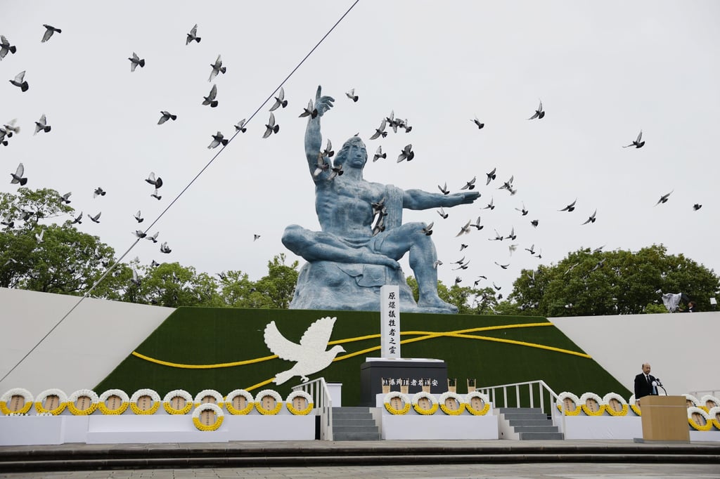 Doves are released over the Peace Statue during a ceremony to mark the 81st anniversary of the US atomic bombing at the Peace Park in Nagasaki, southern Japan, on August 9. Photo: Kyodo/AP