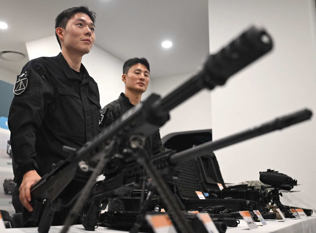 South Korean soldiers display guns during a civil defence drill against possible artillery attacks by North Korea on Thursday. Photo: AFP