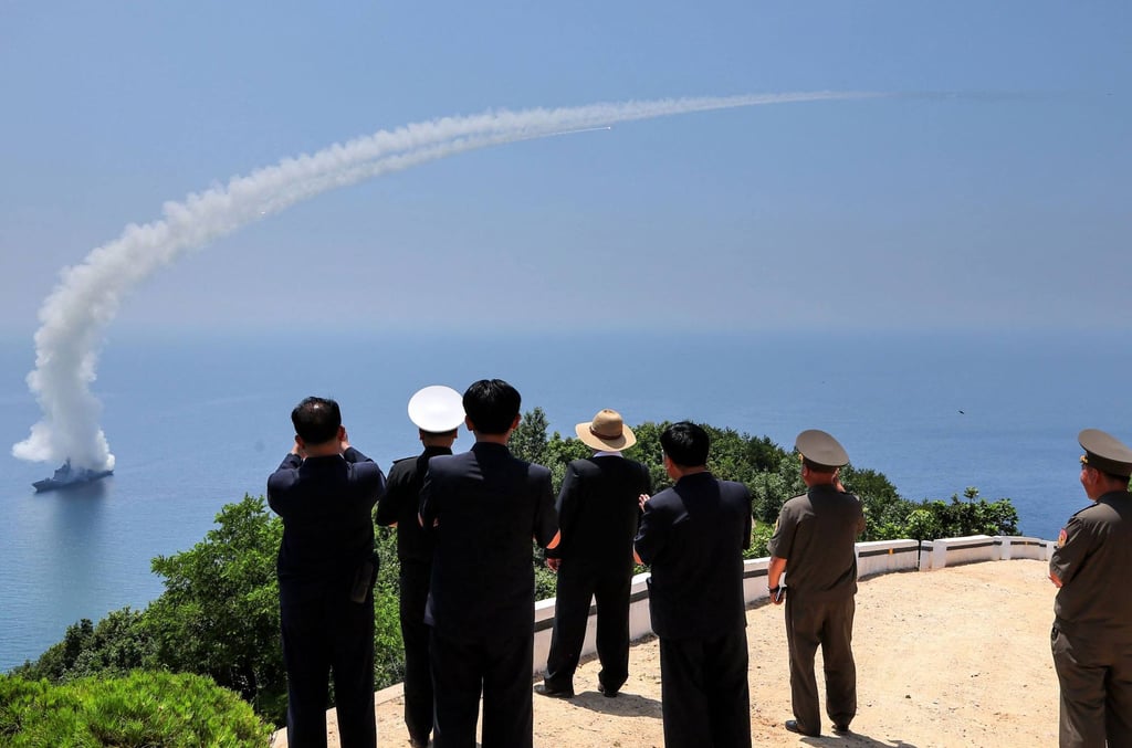 North Korea’s leader Kim Jong-un (centre) watches performance tests of a weapons system on the destroyer Kang Kon at an undisclosed location last month. Photo: KCNA / KNS / AFP