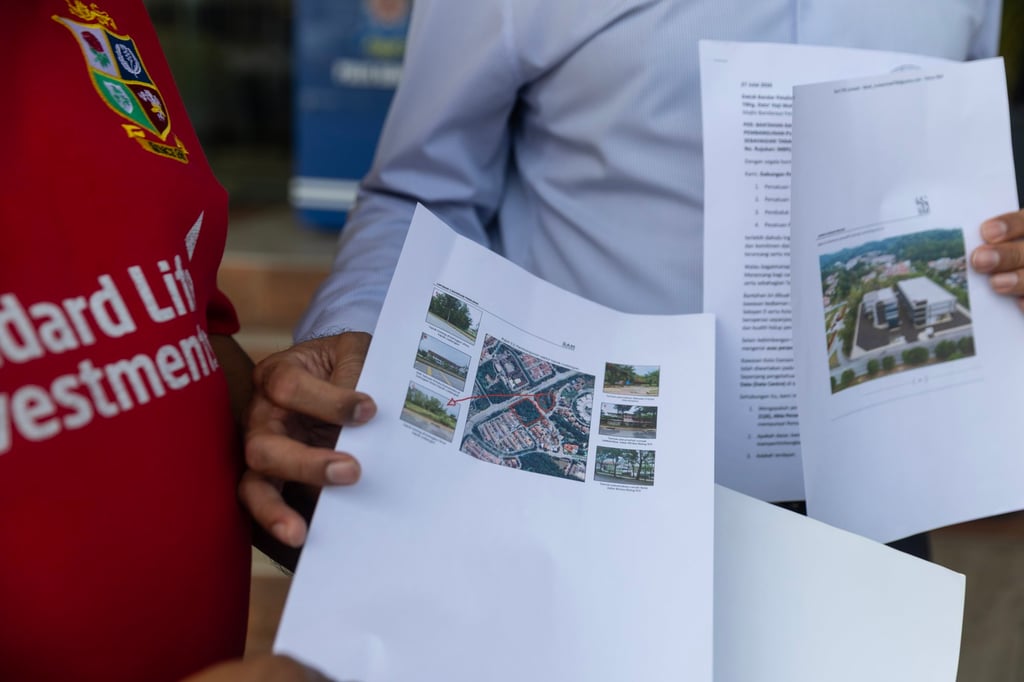 A man points to a location of the data centres near his home during a protest outside Petaling Jaya City Council office outside Kuala Lumpur, Malaysia, on July 27. Photo: EPA A man points to a location of the data centres near his home during a protest outside Petaling Jaya City Council office outside Kuala Lumpur, Malaysia, on July 27. Photo: EPA