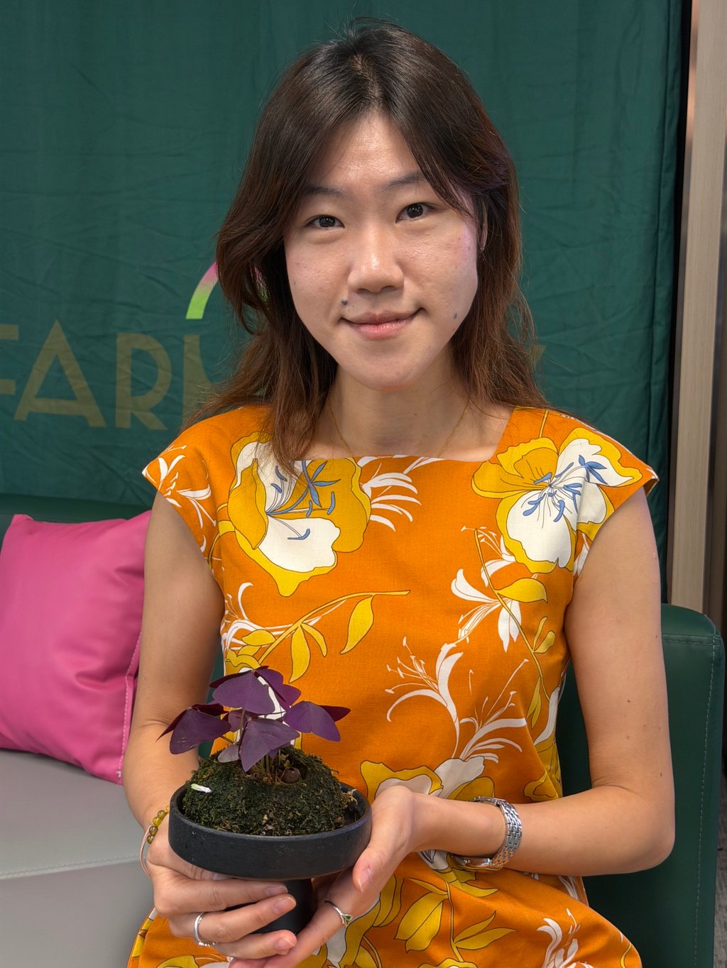 Horticultural therapist Linda Lee holds a plant craft creation at Farmacy’s headquarters in Shau Kei Wan, Hong Kong. Photo by Emma White