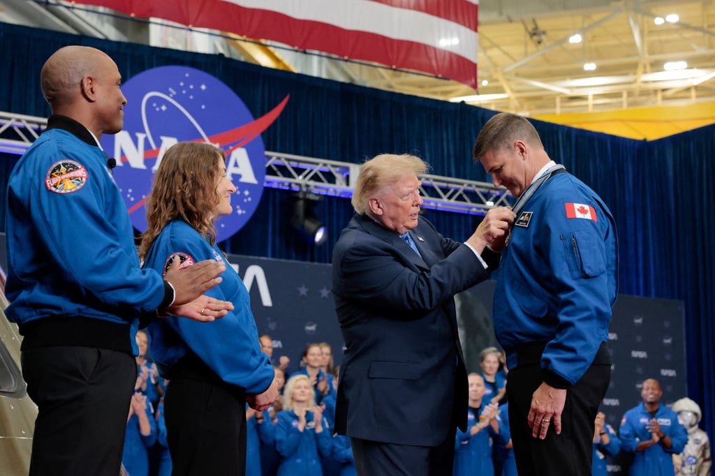 Trump presents Canadian astronaut Jeremy Hansen with a medal at Nasa’s Johnson Space Centre in Houston on Friday. Photo: Reuters Trump presents Canadian astronaut Jeremy Hansen with a medal at Nasa’s Johnson Space Centre in Houston on Friday. Photo: Reuters