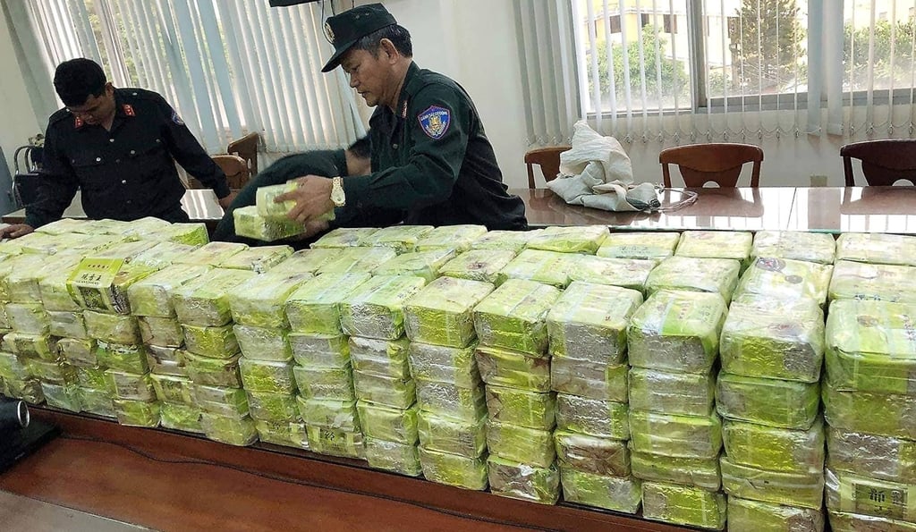 Vietnamese officers stack packages of seized methamphetamine at a police station in Ho Chi Minh City in March 2019. Photo: Vietnam News Agency/AFP